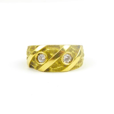 Lot 739 - An Egyptian yellow gold ring set with two...