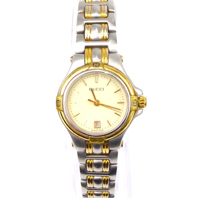 Lot 872 - GUCCI: a ladies' bi-colour stainless steel...