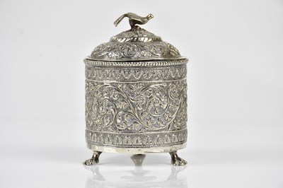 Lot 2216 - An Eastern white metal cylindrical jar and...