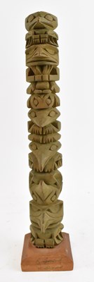 Lot 551 - RAYMOND WILLIAMS; a carved wooden totem pole,...