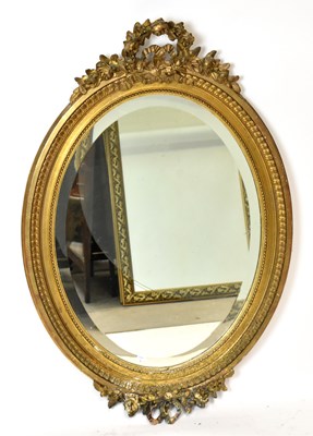 Lot 1465 - A 19th century gilt framed wall mirror of oval...
