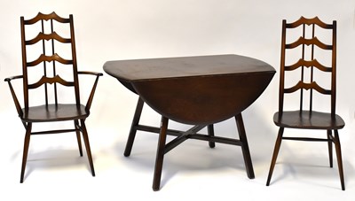 Lot 33 - ERCOL; a set of four ladder back chairs,...