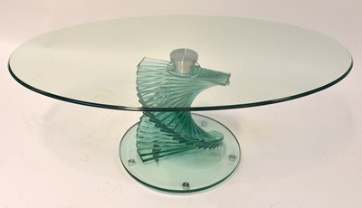 Lot 40 - A contemporary tempered glass oval coffee...