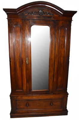 Lot 1639 - A 19th century wardrobe, the arched pediment...
