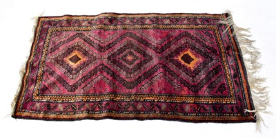 Lot 141 - An Afghan and Turkmen Beluch hand-knotted rug,...