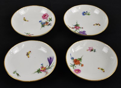 Lot 802 - BERLIN KPM; a set of four porcelain saucers,...