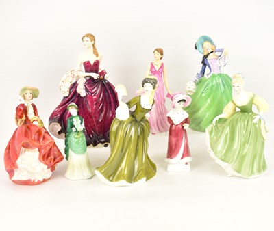 Lot 392 - ROYAL DOULTON; seven porcelain figurines...