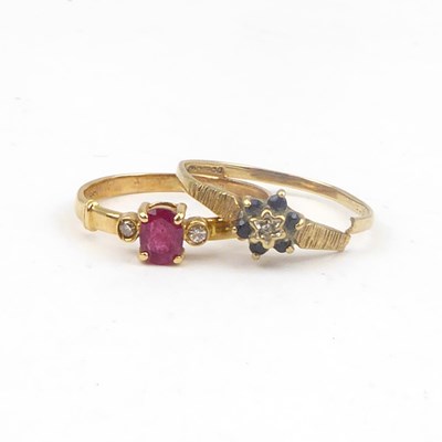 Lot 712 - A 14ct gold ruby and tiny diamond chip ring,...