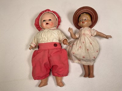 Lot 343 - Two composition dolls, one cloth body baby...