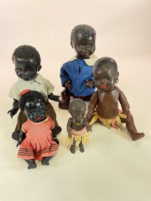 Lot 352 - A collection of black dolls comprising a...