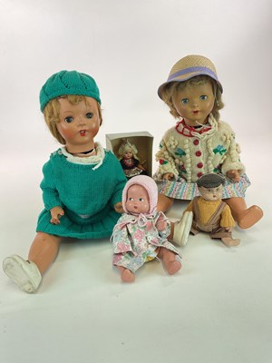 Lot 353 - A group of five dolls including a 22" 1940s...