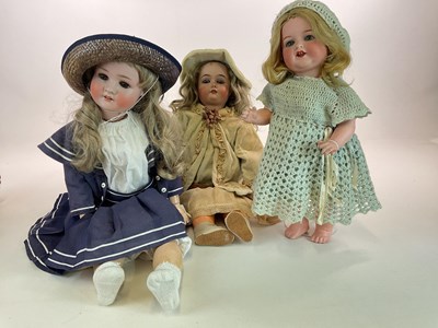 Lot 355 - Three bisque headed dolls comprising a...