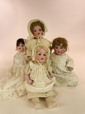 Lot 358 - Four bisque vintage dolls comprising an Armand...