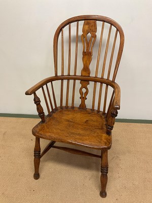 Lot 639 - A 19th century hoop back Windsor elbow chair...