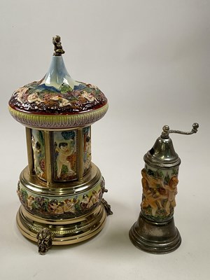 Lot 45 - CAPODIMONTE; a large cherub embossed musical...
