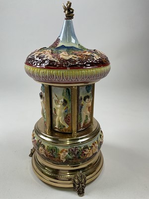 Lot 45 - CAPODIMONTE; a large cherub embossed musical...