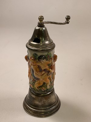 Lot 45 - CAPODIMONTE; a large cherub embossed musical...