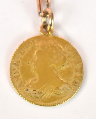 Lot 1312 - A Queen Anne half guinea, 1713, with ring loop...