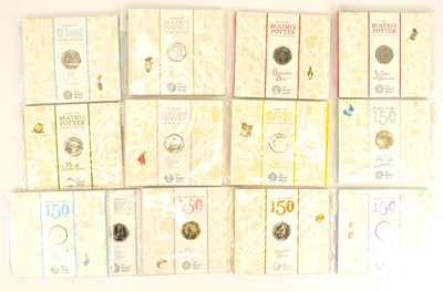 Lot 663 - THE ROYAL MINT; thirteen Beatrix Potter 50p UK...