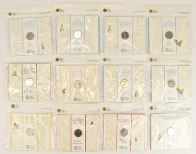 Lot 666 - THE ROYAL MINT; twelve UK 50p uncirculated...