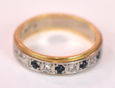 Lot 1241 - An 18ct white and yellow gold sapphire and...