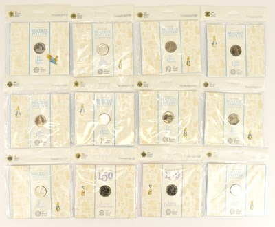 Lot 665 - THE ROYAL MINT; twelve UK 50p uncirculated...