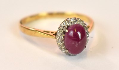 Lot 1244 - An 18ct yellow gold platinum tipped star ruby...