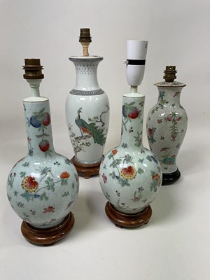Lot 513 - A pair of Chinese floral decorated lamp bases,...