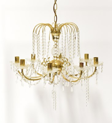 Lot 68 - A brass-effect eight-branch electrolier with...