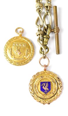 Lot 869 - A 9ct gold fob in the form of a medallion,...