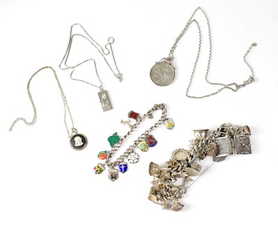 Lot 823 - A hallmarked silver charm bracelet set with a...