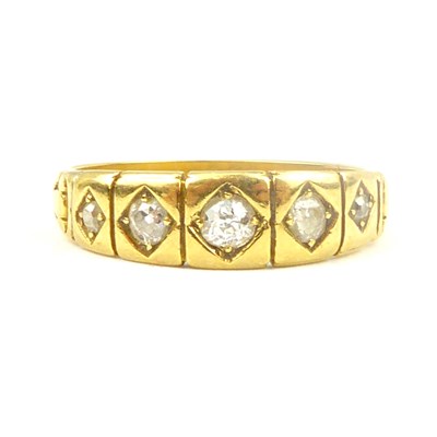 Lot 706 - An 18ct gold ring with five flush set...