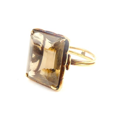 Lot 714 - A 9ct gold dress ring with claw set square cut...