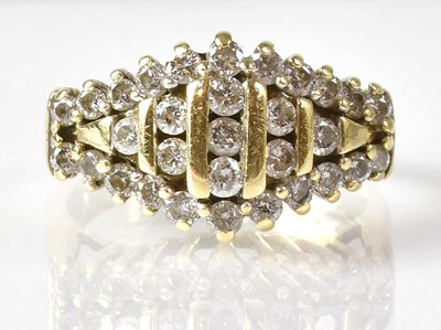 Lot 711 - A 14ct diamond cluster ring with an...