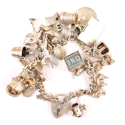 Lot 751 - A silver charm bracelet of approximately...