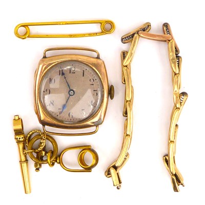 Lot 818 - A 9ct gold watch key, a gold safety pin brooch,...