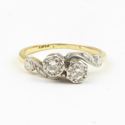 Lot 696 - An 18ct gold ring with two bezel set brilliant...