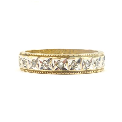 Lot 715 - A 9ct gold eternity ring set with tiny...