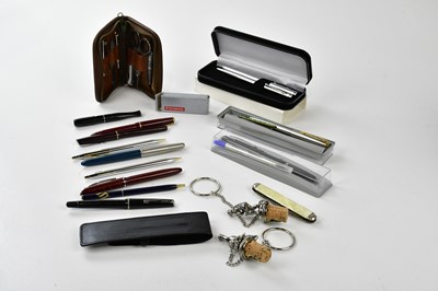 Lot 1381 - A small group of pens, including a red bodied...