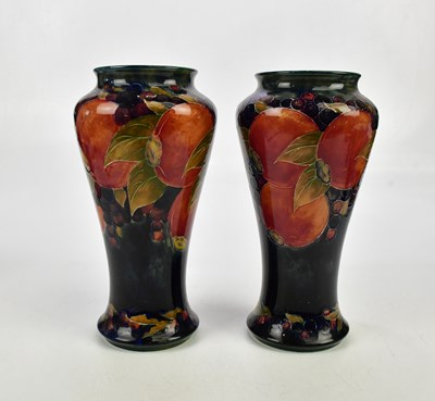 Lot 2204 - WILLIAM MOORCROFT; a pair of shouldered vases...
