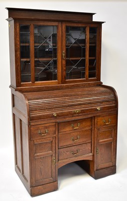 Lot 28 - An early 20th century oak bureau bookcase, the...