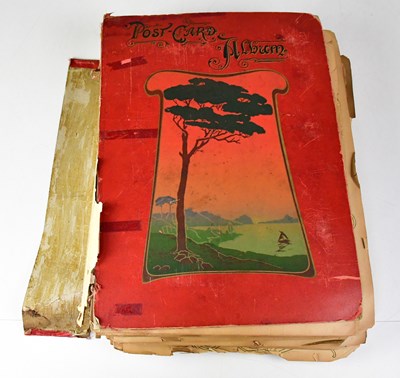 Lot 551 - A postcard album containing black and white...