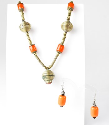Lot 803 - Three metal necklaces, each with...