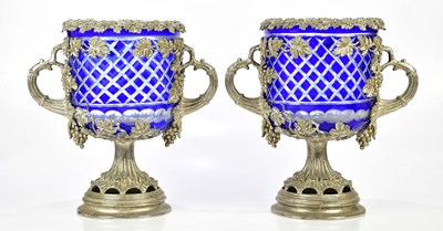 Lot 2004 - A pair of plated urns decorated with fruiting...