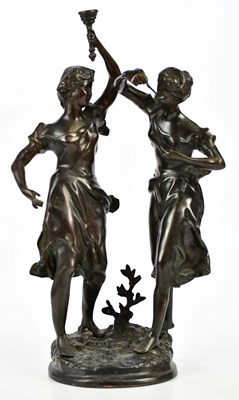 Lot 1443 - A decorative bronze figure group of two...