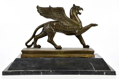 Lot 1440 - A decorative bronze figure of a griffin on...