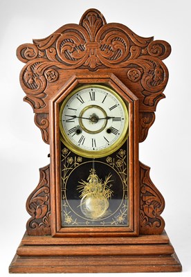 Lot 76 - NEW HAVEN CLOCK CO; an American oak cased...