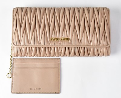 Lot 420 - MIU MIU; a 'Matelassé' napa leather purse in...