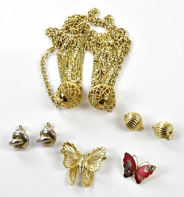 Lot 935 - ISHARYA; a gold tone long double tie pendant...