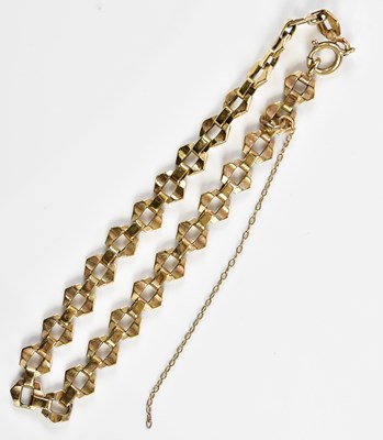 Lot 310 - A 9ct yellow gold bracelet with safety chain,...